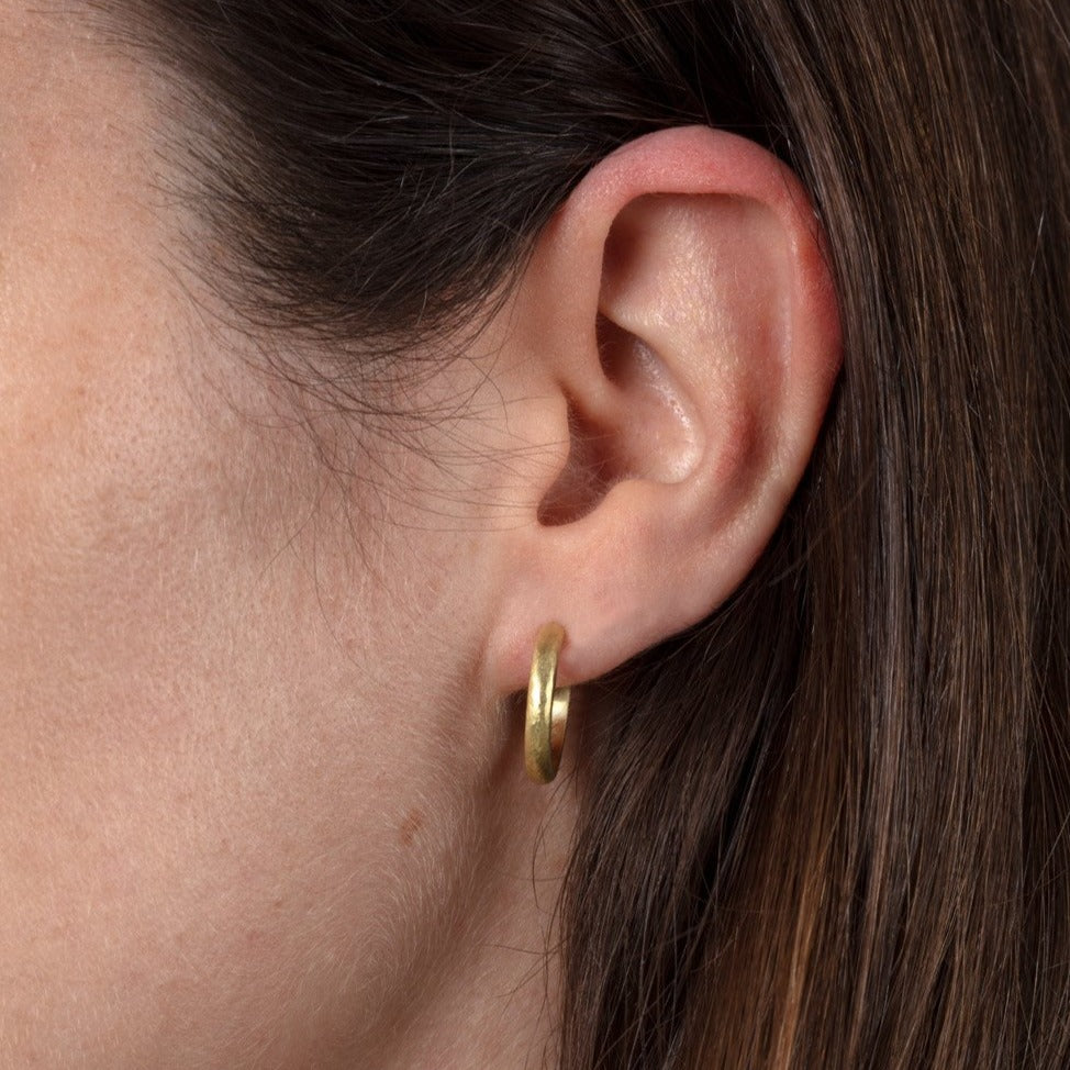 gold hoop on ear