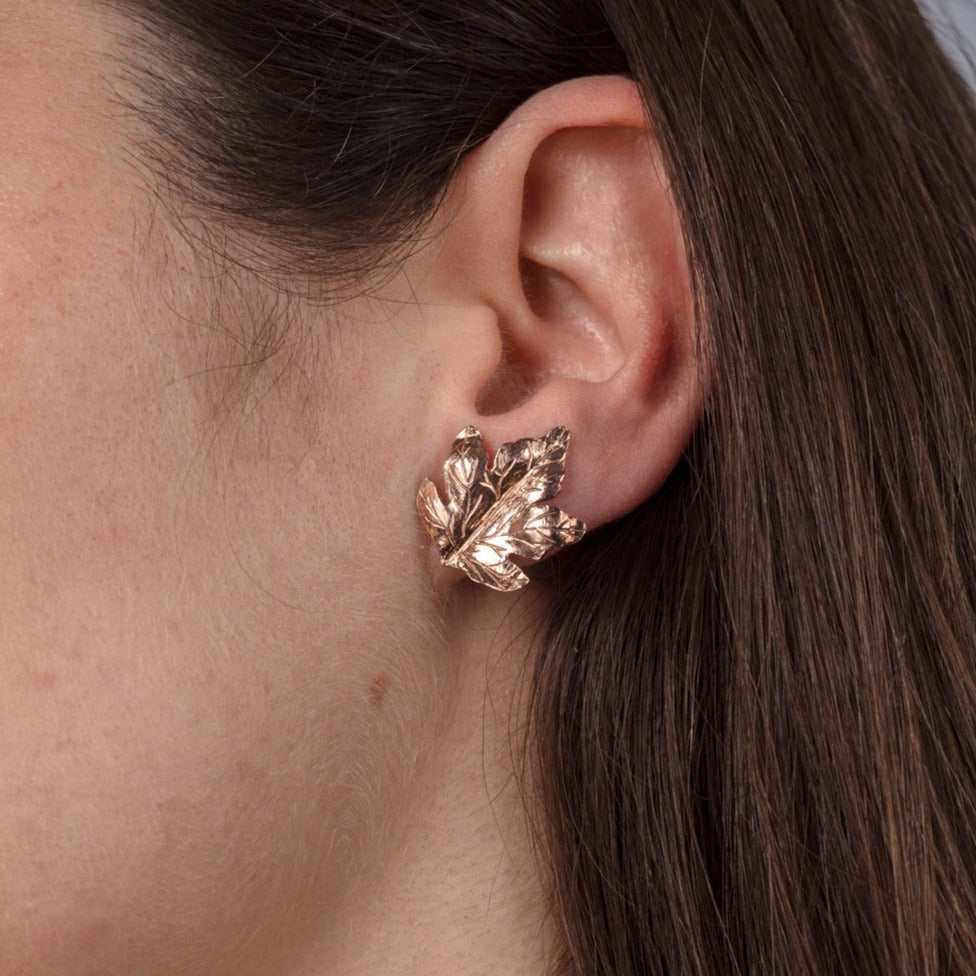 Red gold leaf stud earring shown on model
