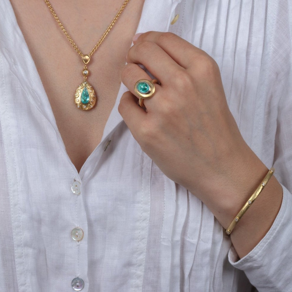 diamond and paraiba tourmaline gold jewellery on a model