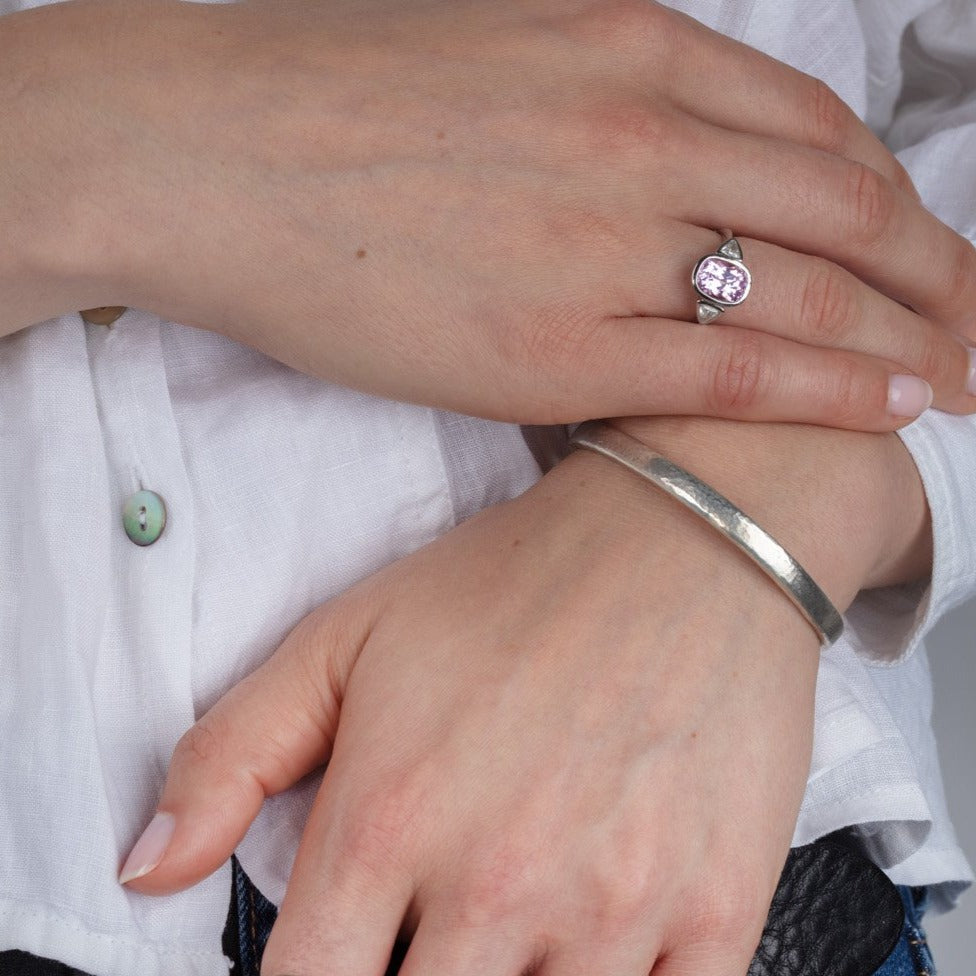 Kunzite and diamond white gold ring on a model