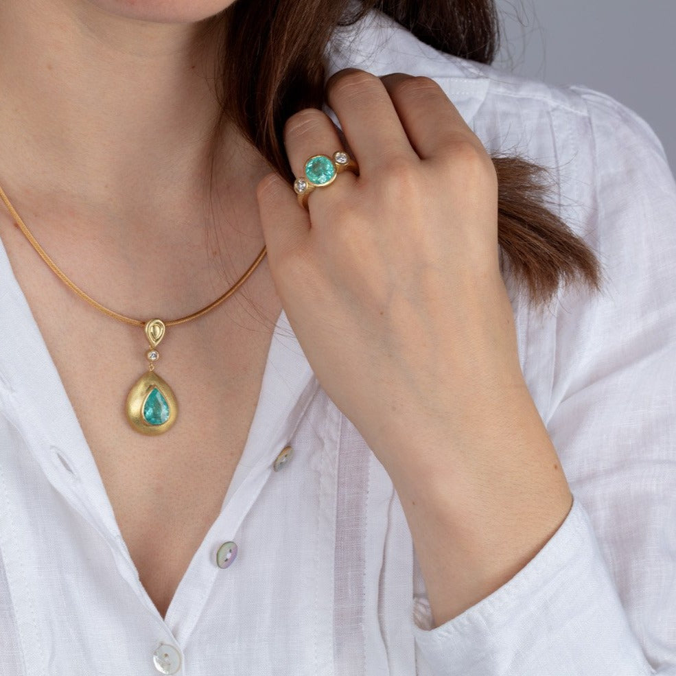 diamond and paraiba tourmaline gold jewellery on a model