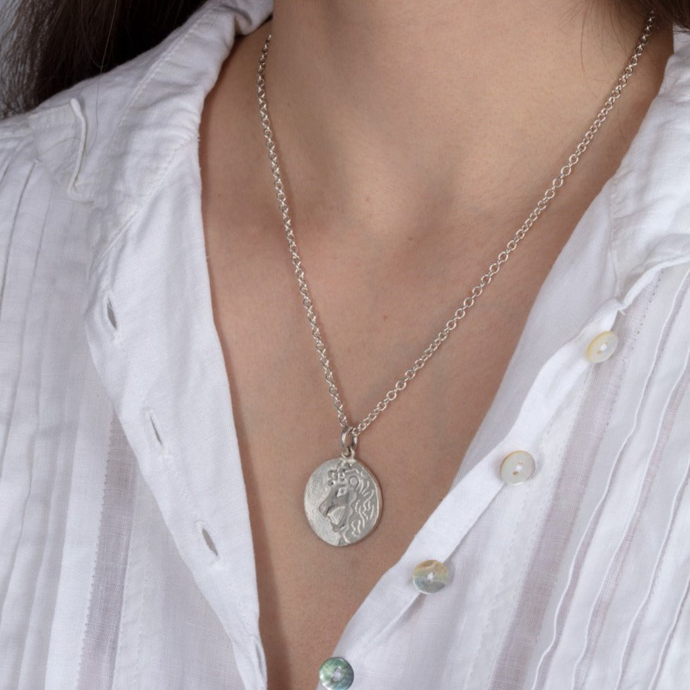 silver disk necklace on model