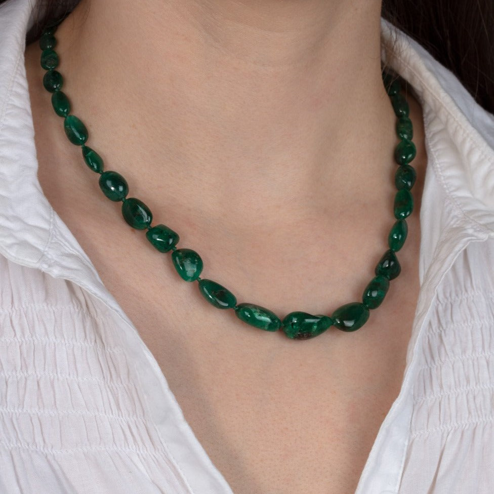 emerald bead necklace shown on a model