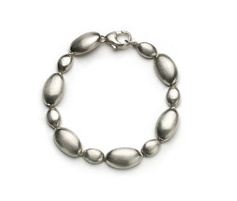 Silver pebble bracelet on white background