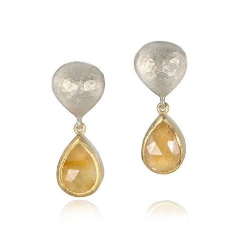 Yellow and white gold yellow sapphire earrings on a white background