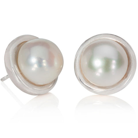Silver and pearl stud earrings shown on a white background