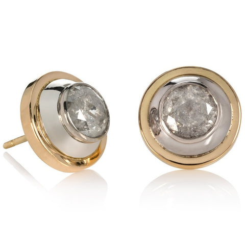18 carat white and yellow gold and diamond earrings on a white background.