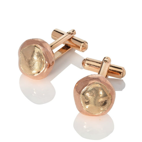 9 carat red and yellow gold conker cufflinks on a white background