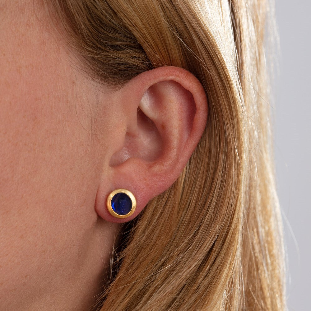 Model pictured wearing small blue sapphire studs