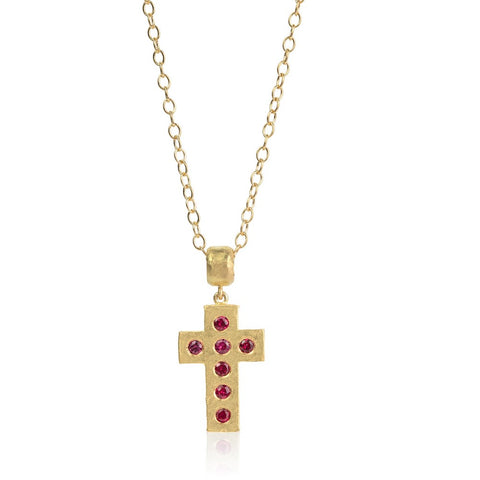 Yellow gold cross set with rubies hung on yellow gold chain