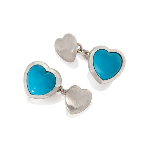 Silver and turquoise heart shape cufflinks on a white background