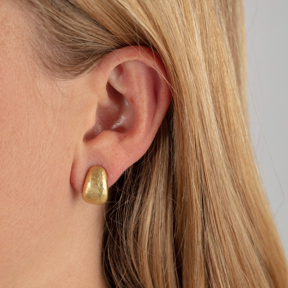 18ct yellow gold hammered half hoops pictured on model's ear
