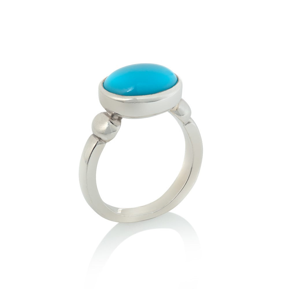 Silver ring set with oval turquoise stone