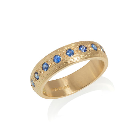 Yellow gold half eternity ring, set with blue sapphires