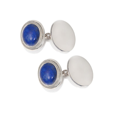 silver cufflinks set with blue stone shown on a white background