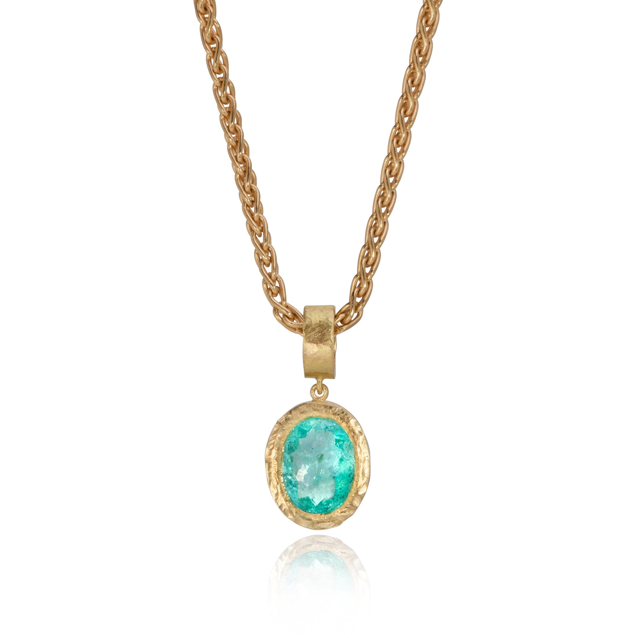 Paraiba tourmaline pendant in textured yellow gold, on white background