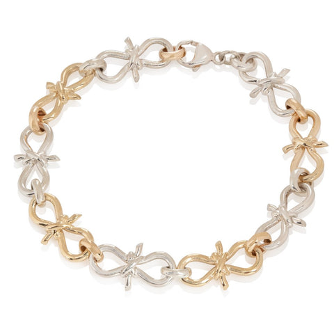  yellow gold and sterling silver twisted link bracelet in a nautical knot motif on white background