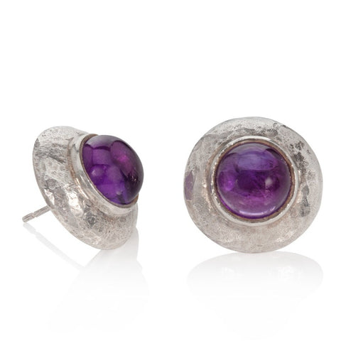 round silver stud earrings with amethysts shown on a white background