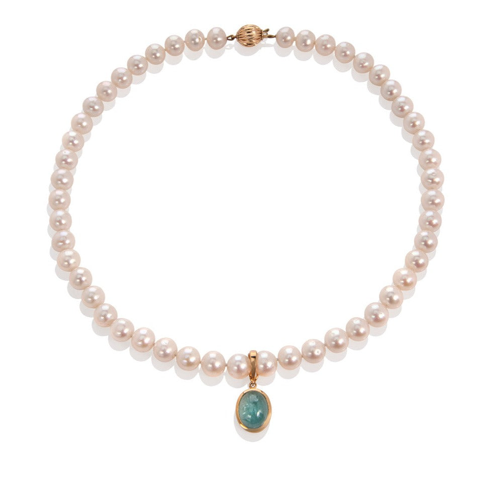 pearl necklace with aquamarine drop pendant shown on a white background