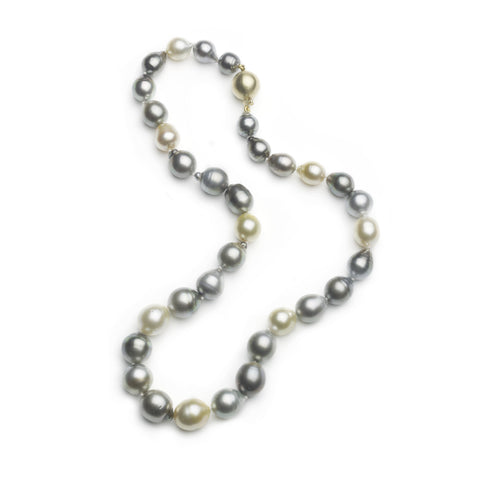 Tahitian black and white pearl and gold necklace on a white background