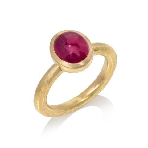 Ruby cabochon ring on white background