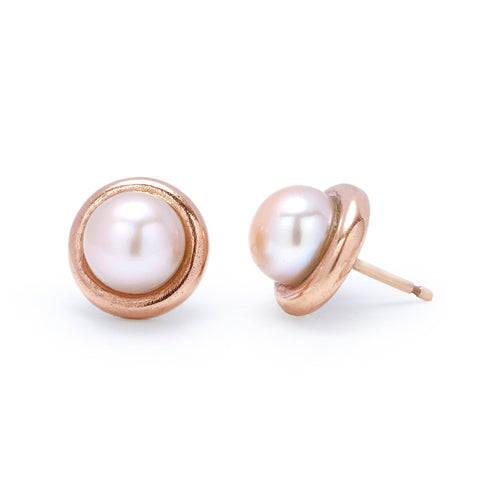 Pearl and 9ct red gold button pearl earrings pictured on white background