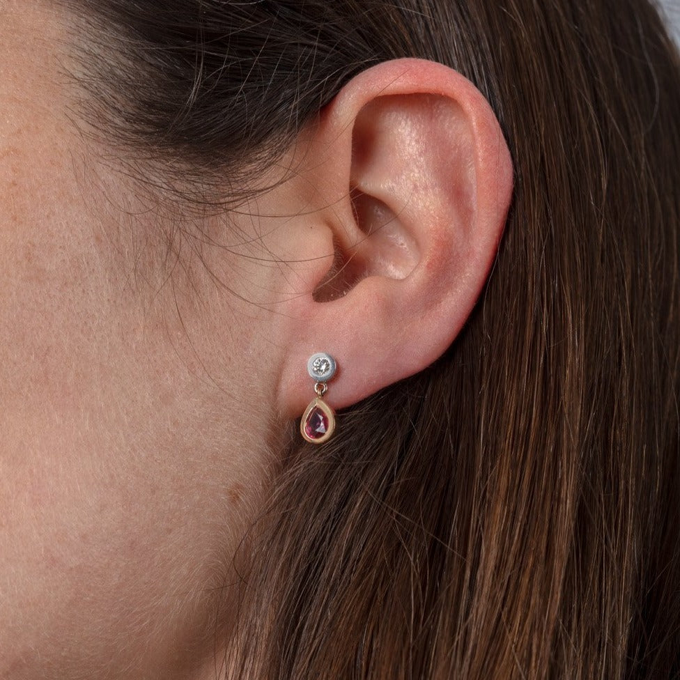 ruby and diamond drop earrings shown on a model