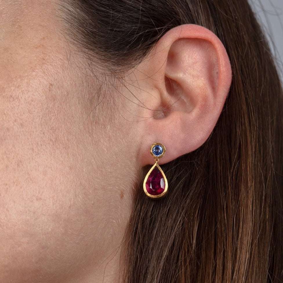 sapphire and rubellite drop earrings shown on a model