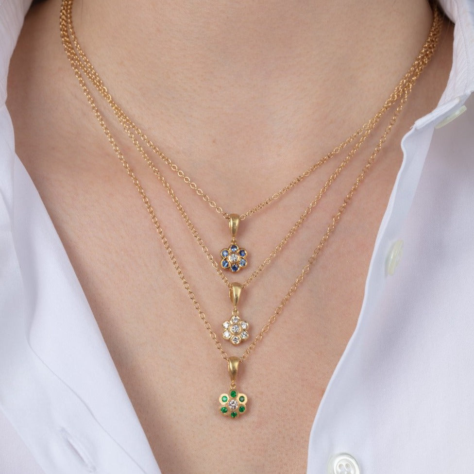 Three gold necklaces on a model