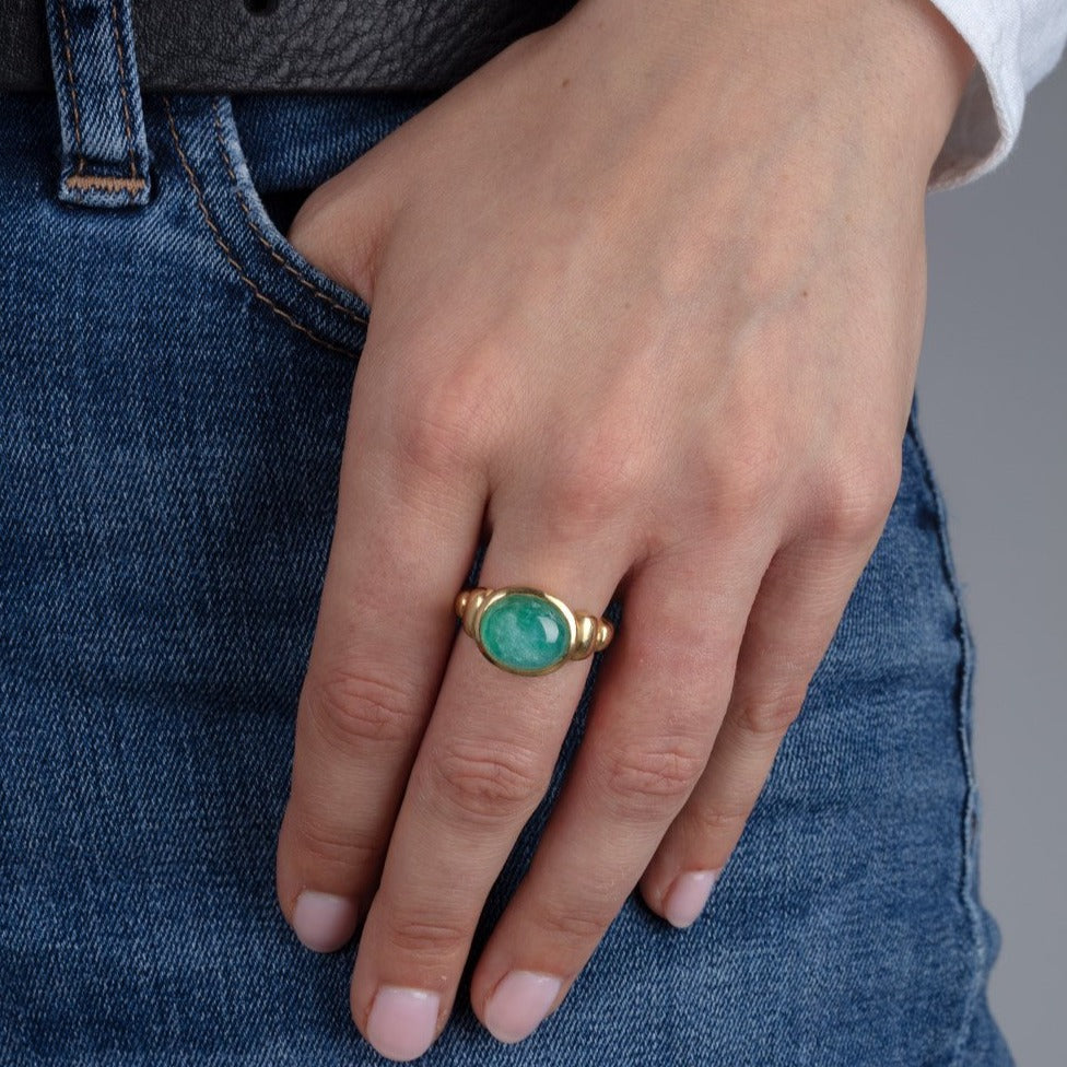 blue paraiba and gold ring on model
