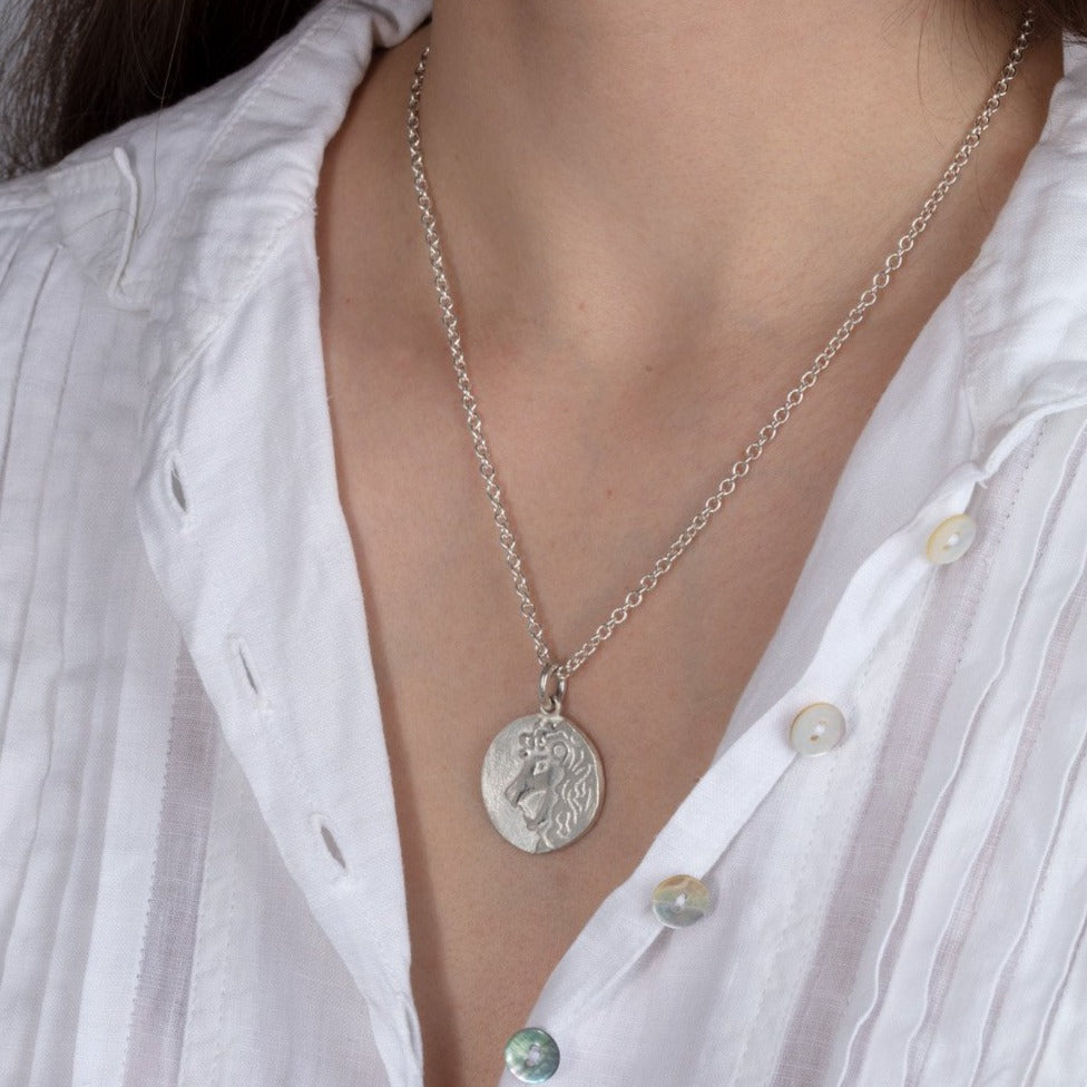 silver disk necklace on model