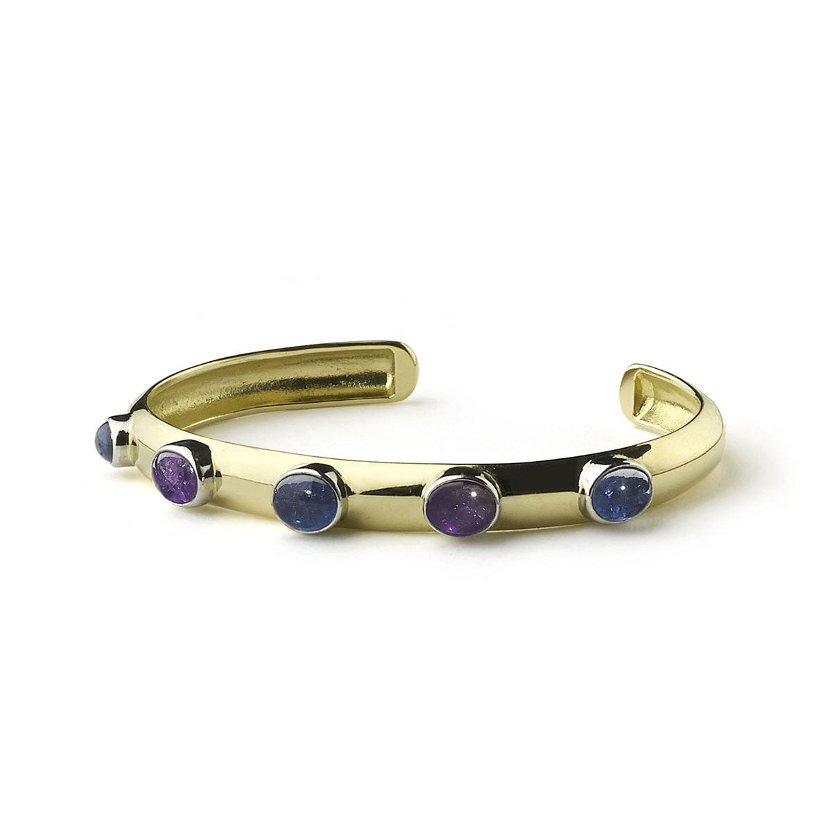 Yellow gold bangle set with blue and purple sapphires in white gold rub-over settings