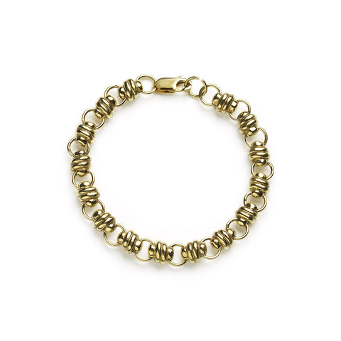 Yellow gold bracelet with chunky links on white background