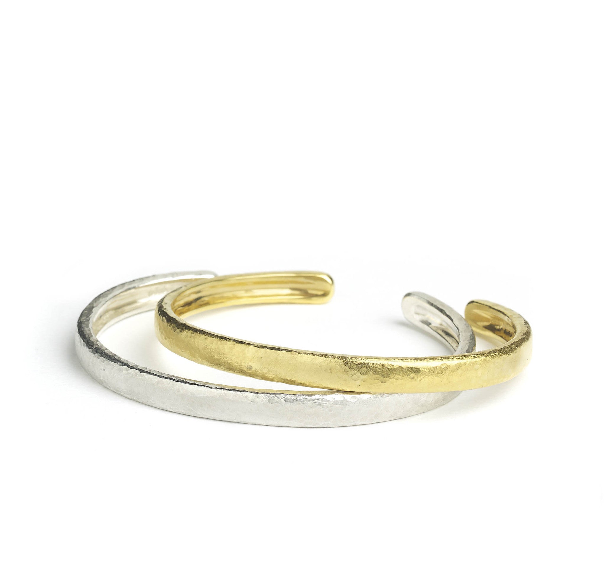 Silver and yellow gold micro-plated bangle with hammered texture finish, on a white background with a solid silver version