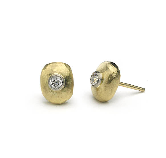 Diamond pebble studs pictured on white, one earring side on