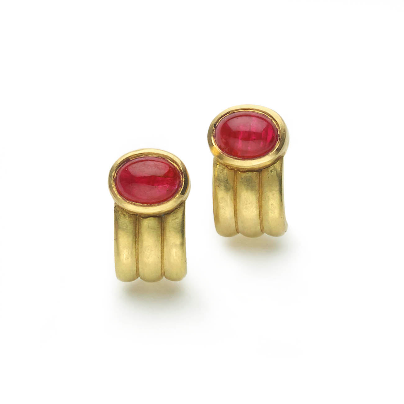 Oval ruby cabochons set in yellow gold ridged 'half hoop' design