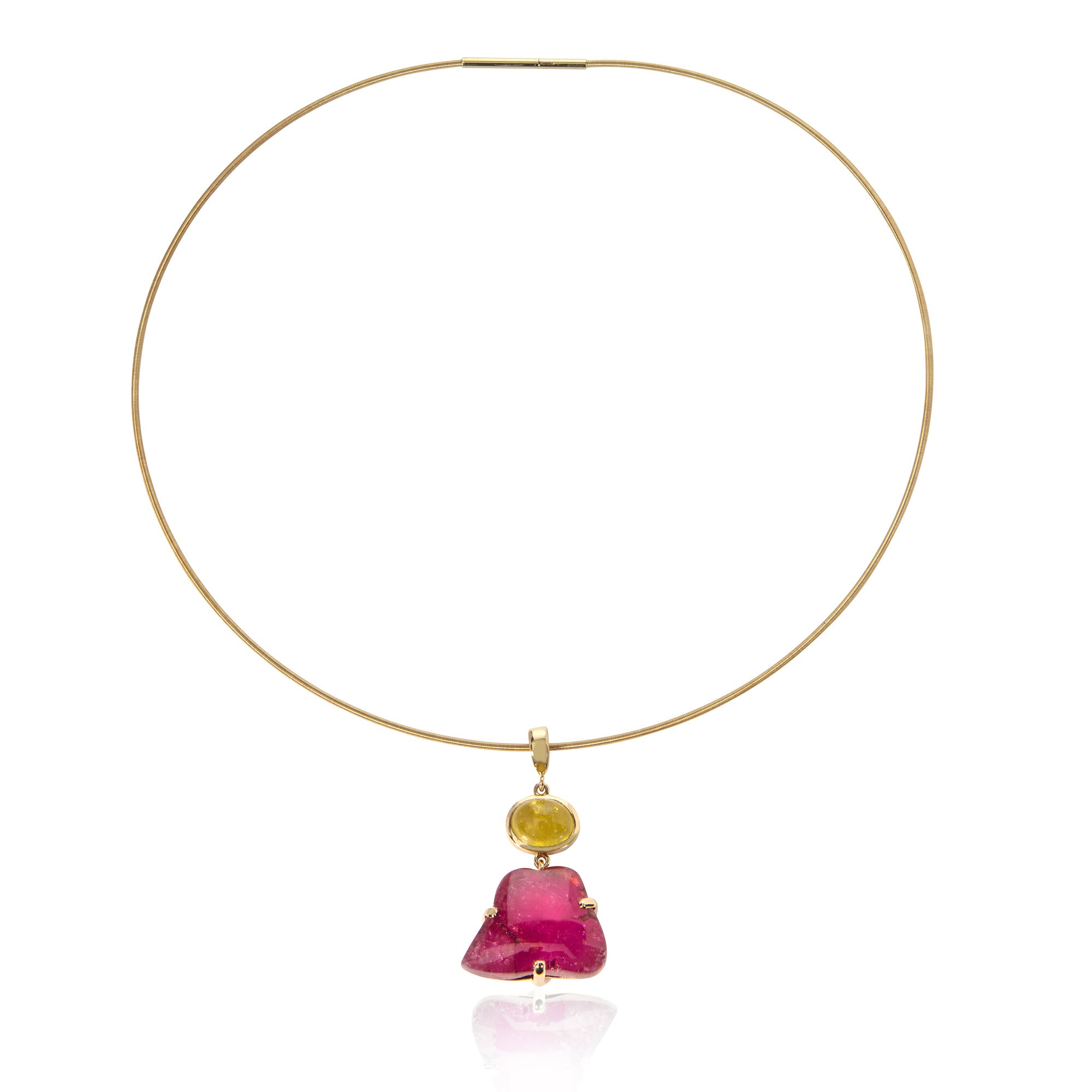 Pendant of pink irregular shaped tourmaline cabochon with yellow tourmaline hung on gold torque on white background