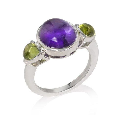 Silver, amethyst and peridot ring on white background