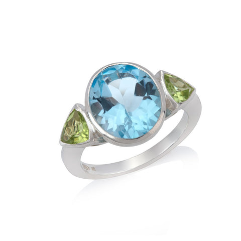 silver ring set with blue topaz and peridot