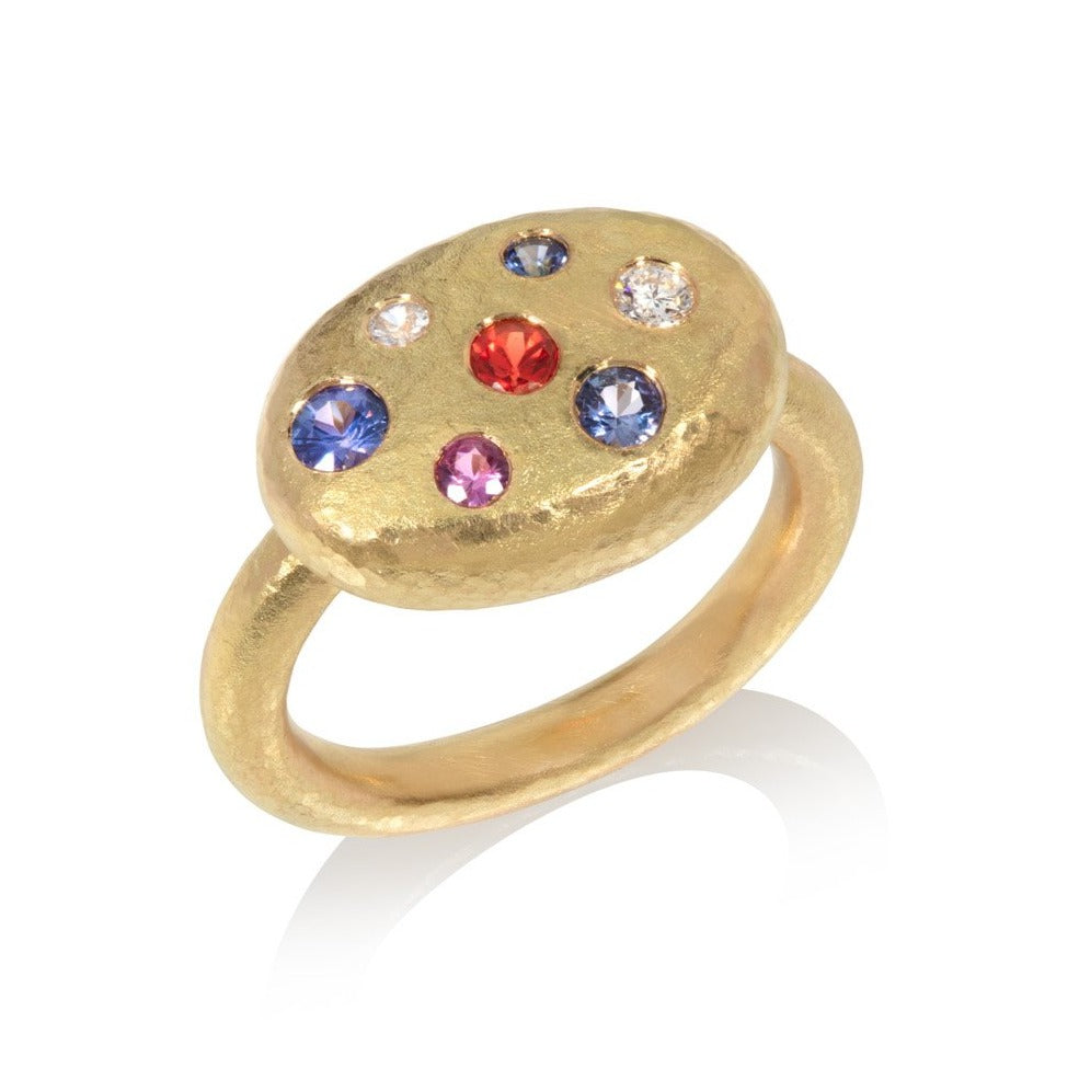 Multi-Stone 18 carat yellow gold ring on a white background