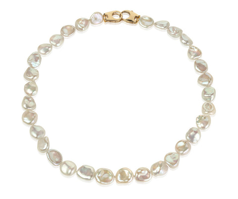 Keshi pearl necklace with 18ct gold clasp on white background
