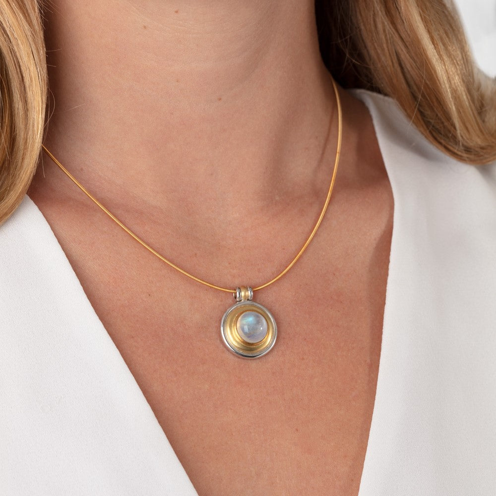 Model pictured wearing yellow and white gold moonstone pendant