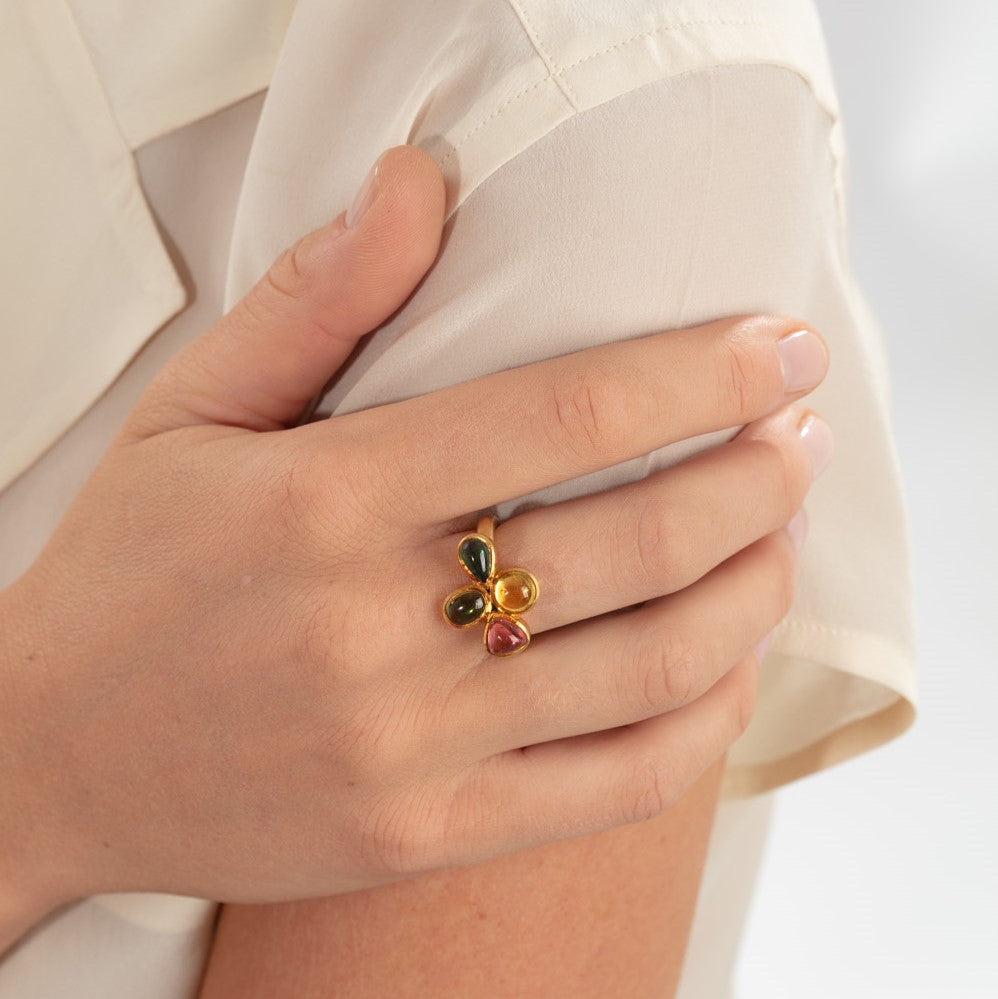 Model pictured wearing tourmaline cabochon flower ring
