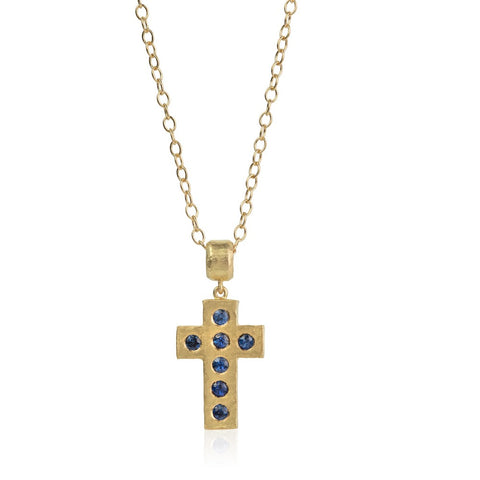 Hammered yellow gold cross, set with round blue sapphires on a gold chain