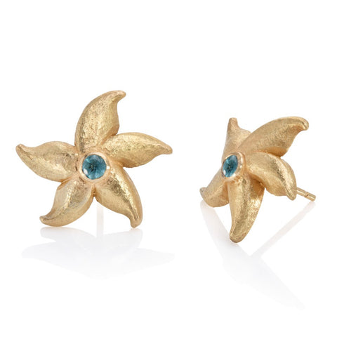 Silver starfish micro-plated with yellow gold, set with blue topaz cabochon stone