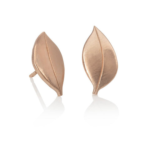 18 carat red gold leaf shaped stud earrings on white background