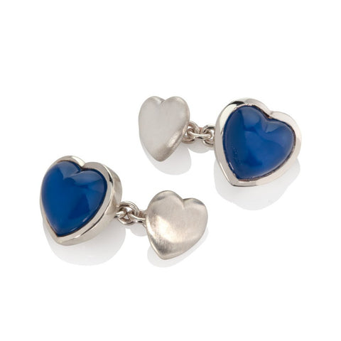 Silver and blue agate heart shaped cufflinks on a white background