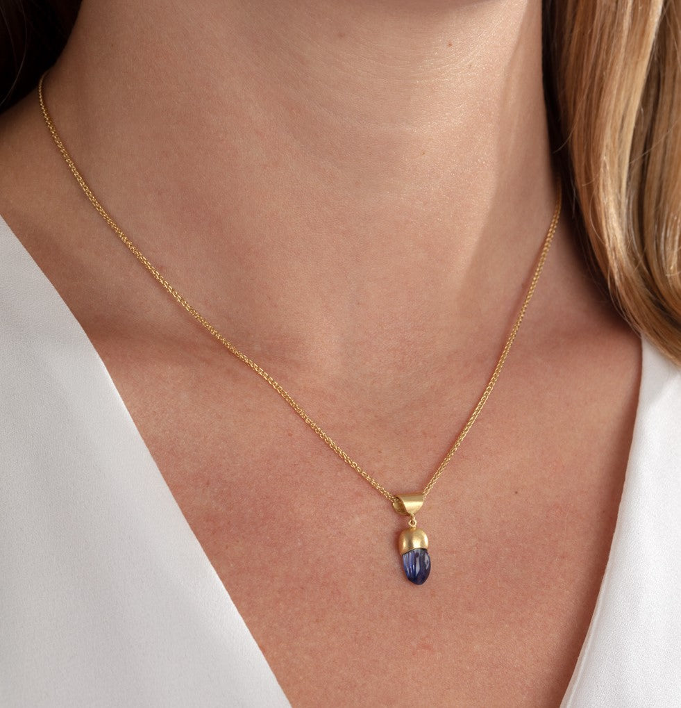 Model wearing blue sapphire free-form necklace