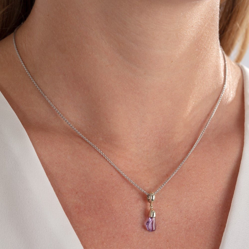 Model pictured wearing lilac sapphire and white gold necklace