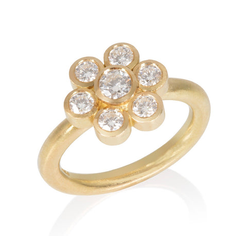 18ct yellow gold diamond ring set in a daisy motif.